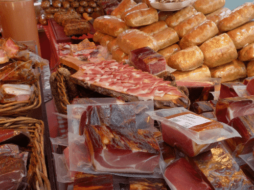 stack of deli, preserved meat and breads