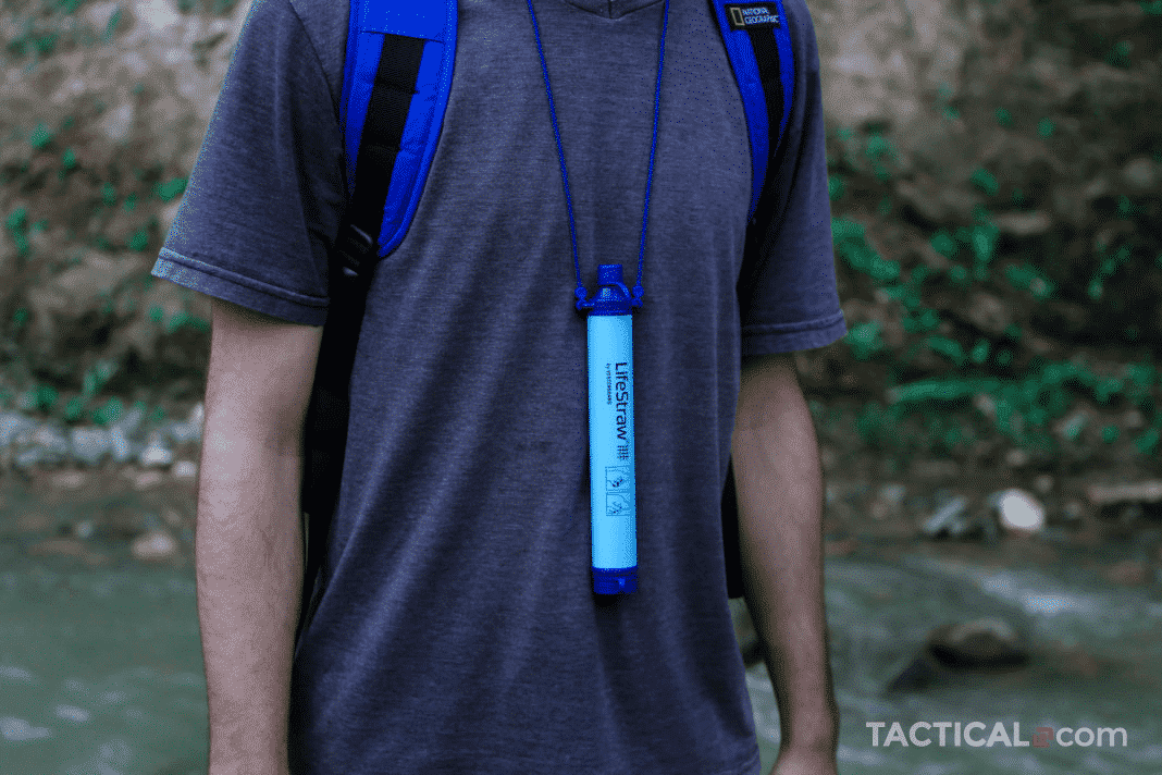 A man with a lanyard attached to a Lifestraw