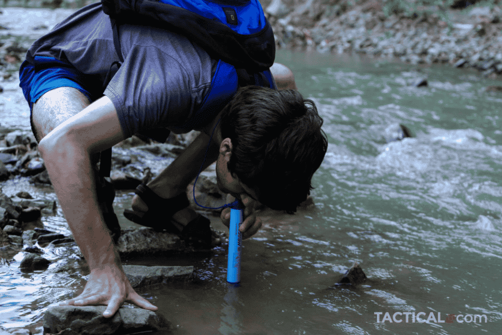 Man drinking water with the LIfestraw