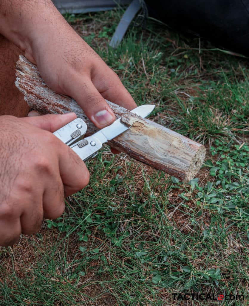 Using a multitool to cut some wood