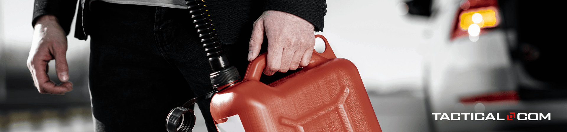 person holding a container of emergency fuel