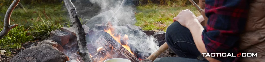 person tending to a fire