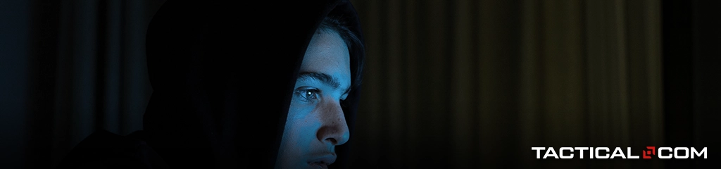 a person's face illuminated in blue light