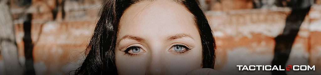 black haired woman with blue eyes staring right at the camera